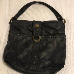 Red by Marc Ecko PVC should bag.  Black with brass hardware.